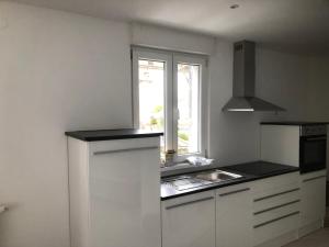 Kuchyň nebo kuchyňský kout v ubytování Appartement Willa chez willi + 16 fotografií