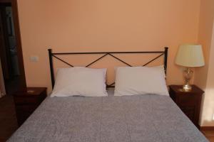Tempat tidur dalam kamar di Analogic tour - Casa vacanze Valleremita
