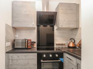 Kuchyň nebo kuchyňský kout v ubytování Apartment 24