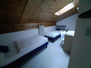 Posteľ alebo postele v izbe v ubytovaní Garnì Belvedere
