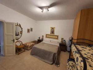 Postel nebo postele na pokoji v ubytování Residenza oleandro rosa