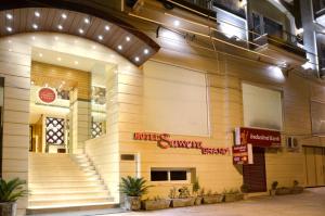 a store front with stairs in front of a building at Sawera Grand in Amritsar