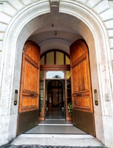 an entrance to a building with wooden doors at WE LOVE ROMA Guest House in Rome