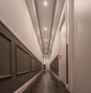 a hallway with a long corridor with a row ofaccidents at WE LOVE ROMA Guest House in Rome