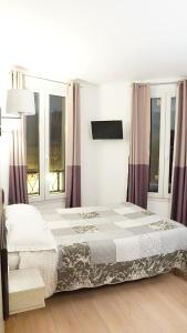 Hotel de l'Europe tesisinde bir odada yatak veya yataklar