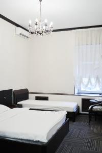 Кровать или кровати в номере Д-Отель Тверская 