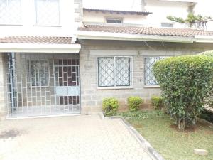 a house with a gate in front of it at Baraka Home in Nairobi