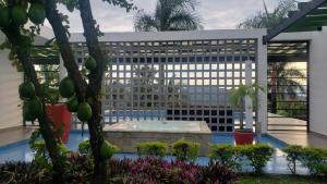a large building with a swimming pool in front of it at Villa Carmen La Mesa in La Mesa