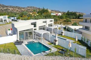 an aerial view of a house with a swimming pool at Pantheon Luxury Villas Rhodes Island in Afantou