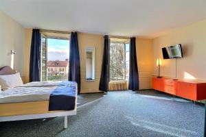 Voodi või voodid majutusasutuse Hôtel Restaurant Bellevue toas