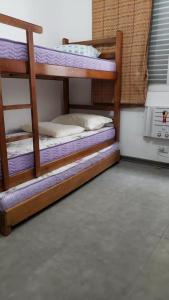 Postel nebo postele na pokoji v ubytování ***Apartamento Pitangueiras Fantástico***