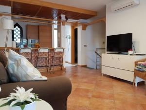 Un televizor și/sau centru de divertisment la Adeje Paradise Apartments