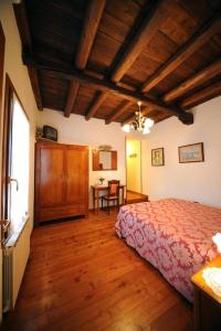 Letto o letti in una camera di AGRITURISMO PRAETTO