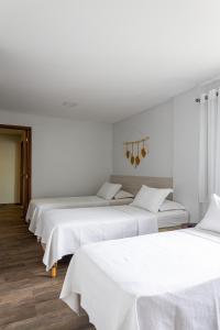 Postel nebo postele na pokoji v ubytování Pousada Casa da Praia Angra