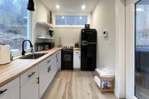 A kitchen or kitchenette at The Hideaway on Tacketts - Shipping Container