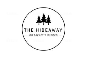 ein Logo für die Bibliothek auf der Packungsbranche in der Unterkunft The Hideaway on Tacketts - Shipping Container in Hurricane
