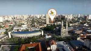an aerial view of a city with a kite in the air at Refúgio Pousada Fortaleza in Fortaleza