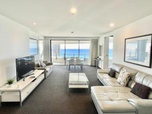 a living room with a couch and a television at 2203 The Wave in Gold Coast