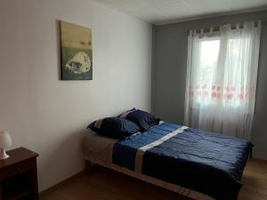 Cama ou camas em um quarto em Maison proche de l'aéroport CDG-Paris