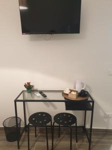TV a/nebo společenská místnost v ubytování Residenza Tarzanà