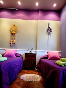 Ein Bett oder Betten in einem Zimmer der Unterkunft Reina Sofia, !Un lugar comodo y bello para compartir!