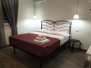 Postel nebo postele na pokoji v ubytování Residenza Tarzanà