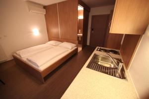 Postel nebo postele na pokoji v ubytování Fair-Price-Hotel