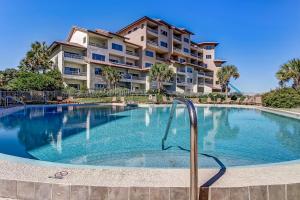 a large swimming pool in front of a building at 255 Sandcastles in Fernandina Beach