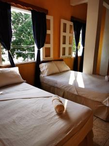 Кровать или кровати в номере Natz Hotel