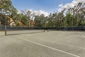 a tennis court with a net on it at 2533 Tennis Villas Efficiency in Fernandina Beach