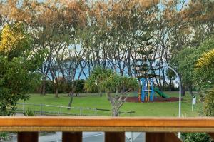 a playground in a park with at Byron Bay Accom Gilmore Court 4 in Byron Bay