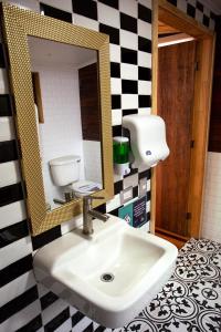 a bathroom with a sink and a mirror at Cabañas Tungulú in Puerto Montt