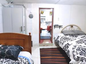 Rúm í herbergi á Cuzco Central Hostel