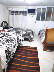 Rúm í herbergi á Cuzco Central Hostel