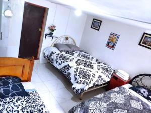 Rúm í herbergi á Cuzco Central Hostel