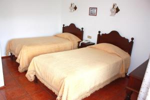 Postel nebo postele na pokoji v ubytování Hotel Dona Leonor