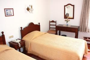 Postel nebo postele na pokoji v ubytování Hotel Dona Leonor