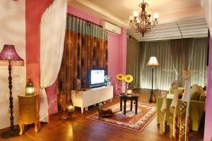 TV a/nebo společenská místnost v ubytování Hao Wang Jiao House
