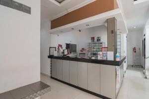 a lobby with a counter in a room at RedDoorz near Alun Alun Bandung 3 in Bandung