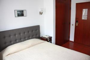 Postel nebo postele na pokoji v ubytování Hotel Dona Leonor