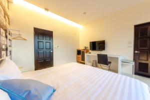 Voodi või voodid majutusasutuse WanTon B&B toas