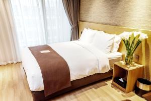 Intrada Icheon Hotel客房内的一张或多张床位