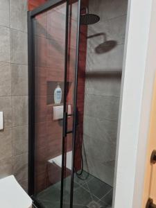 a shower with a glass door in a bathroom at Altea city center in Altea