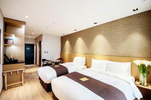 Intrada Icheon Hotel客房内的一张或多张床位