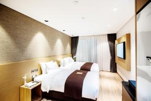 Intrada Icheon Hotel客房内的一张或多张床位