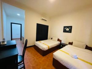 Postel nebo postele na pokoji v ubytování Angkor Tiger Resort