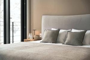 Postel nebo postele na pokoji v ubytování Shinka Niseko