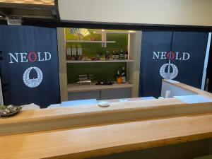 a newald store with blue curtains and a counter at NEOLD Private House in Yoshino +40 photos