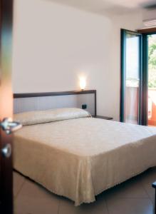 Cama ou camas em um quarto em Residence Gli Ulivi di Eolo