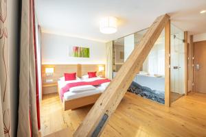 Ένα ή περισσότερα κρεβάτια σε δωμάτιο στο Hotel Loy